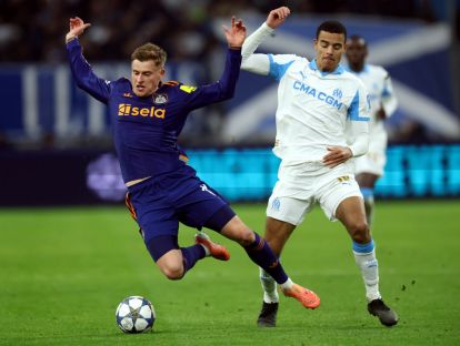 MARSEILLE, FRANCE - NOVEMBER 25: Harvey Barnes of Newcastle United is challenged by Mason Greenwood of Olympique de Marseille during the UEFA Champions League 2025/26 League Phase MD5 match between Olympique de Marseille and Newcastle United FC at Stade de Marseille on November 25, 2025 in Marseille, France.