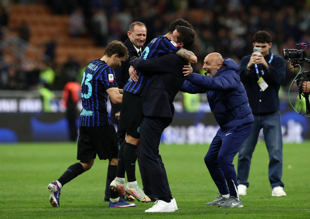 MILAN, ITALY - APRIL 21: Cristian Chivu, Head Coach of FC Internazionale Milano, celebrates with Hakan Calhanoglu after during the Coppa Italia Semi-Final match between FC Internazionale and Como at San Siro on April 21, 2026 in Milan, Italy. (Photo by Marco Luzzani/Getty Images)