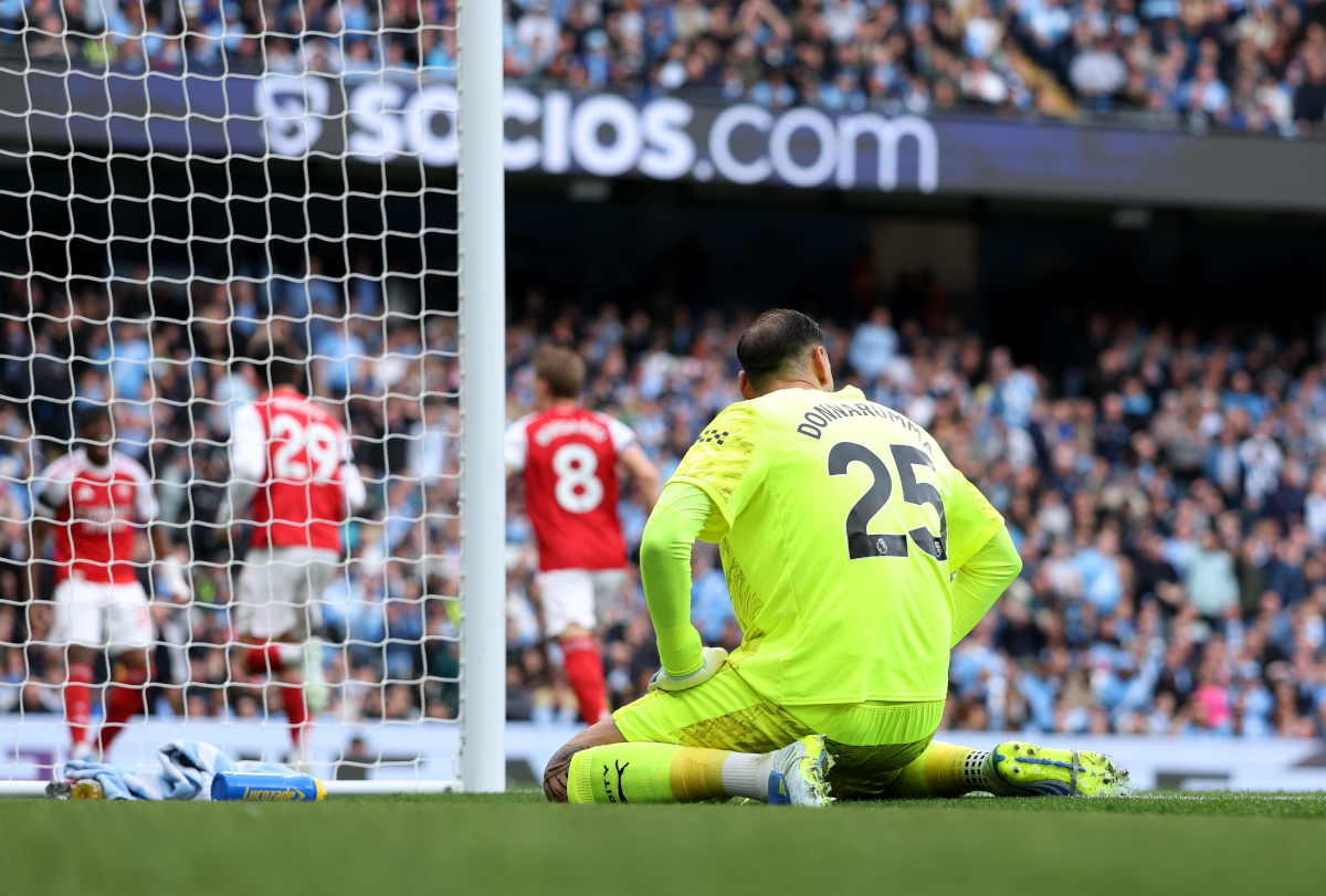MANCHESTER, ENGLAND - APRIL 19: Gianluigi Donnarumma of Manchester City looks dejected after miss kicking his clearance straight to Kai Havertz of Arsenal (not pictured), who scores his team's first goal during the Premier League match between Manchester City and Arsenal at Etihad Stadium on April 19, 2026 in Manchester, England. (Photo by Michael Regan/Getty Images)