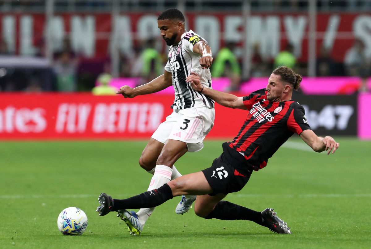MILAN, ITALY - APRIL 26: Bremer of Juventus is challenged by Adrien Rabiot of AC Milan during the Serie A match between AC Milan and Juventus FC at Giuseppe Meazza Stadium on April 26, 2026 in Milan, Italy. (Photo by Marco Luzzani/Getty Images)