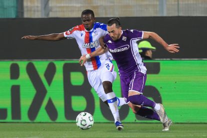 FLORENCE, ITALY - APRIL 16: Tyrick Mitchell of Crystal Palace FC in action against Jack Harrison of ACF Fiorentina during the UEFA Conference League 2025/26 Quarter-Final Leg Two match between ACF Fiorentina and Crystal Palace FC at Stadio Artemio Franchi on April 16, 2026 in Florence, Italy. (Photo by Gabriele Maltinti/Getty Images)