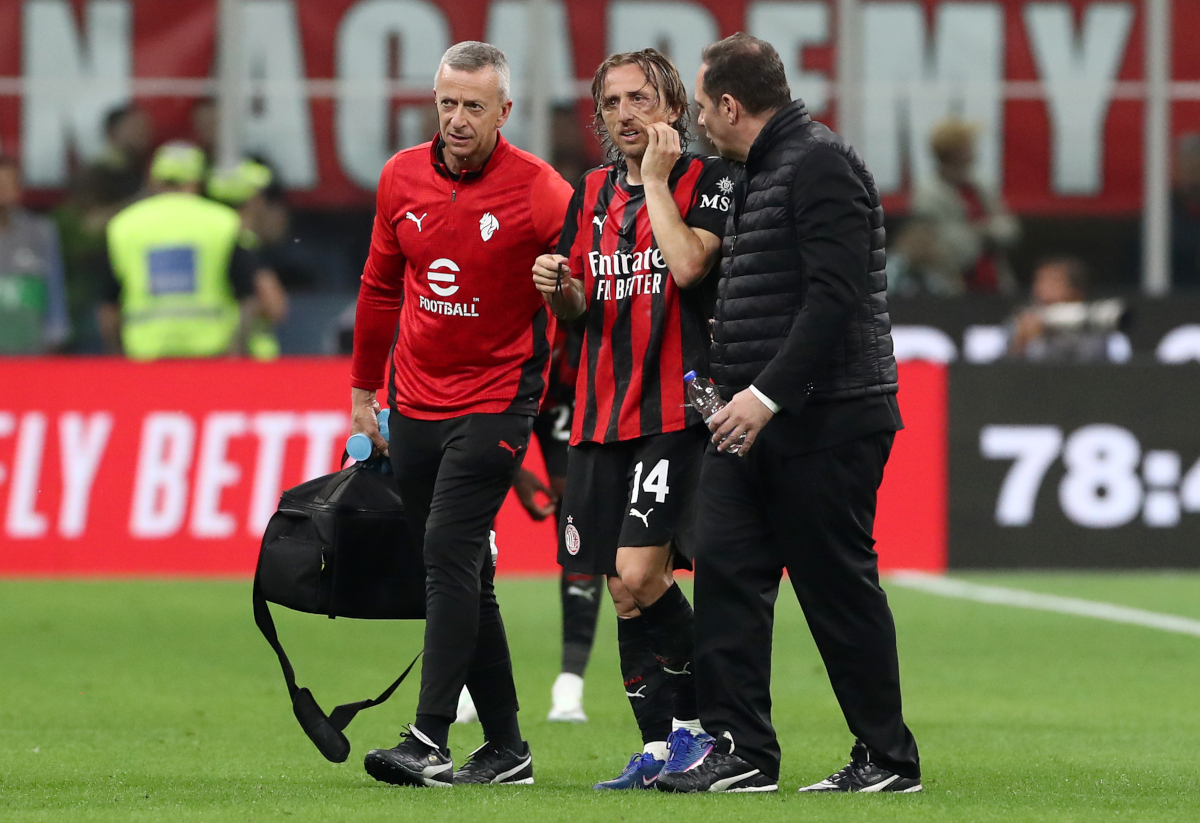 MILAN, ITALY - APRIL 26: Luka Modric of AC Milan is assisted off by medical staff after going down injured during the Serie A match between AC Milan and Juventus FC at Giuseppe Meazza Stadium on April 26, 2026 in Milan, Italy. (Photo by Marco Luzzani/Getty Images)