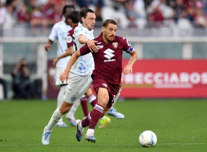 TURIN, ITALY - APRIL 26: Nikola Vlasic of Torino is challenged by Matteo Darmian of FC Internazionale Milano during the Serie A match between Torino FC and FC Internazionale at Stadio Olimpico di Torino on April 26, 2026 in Turin, Italy. (Photo by Valerio Pennicino/Getty Images)