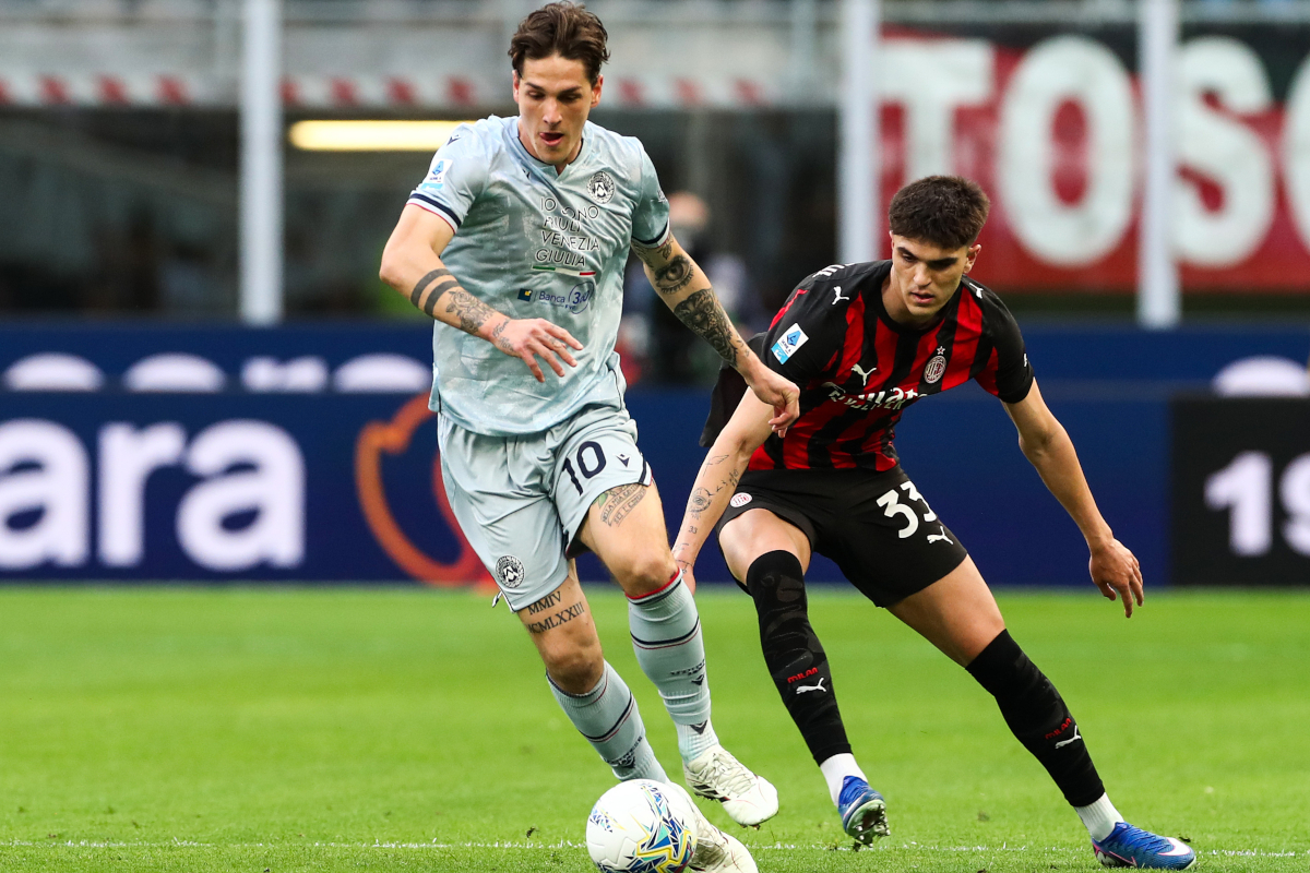 MILAN, ITALY - APRIL 11: Nicolo Zaniolo of Udinese Calcio is put under pressure by Davide Bartesaghi of AC Milan during the Serie A match between AC Milan and Udinese Calcio at Giuseppe Meazza Stadium on April 11, 2026 in Milan, Italy. (Photo by Marco Luzzani/Getty Images)