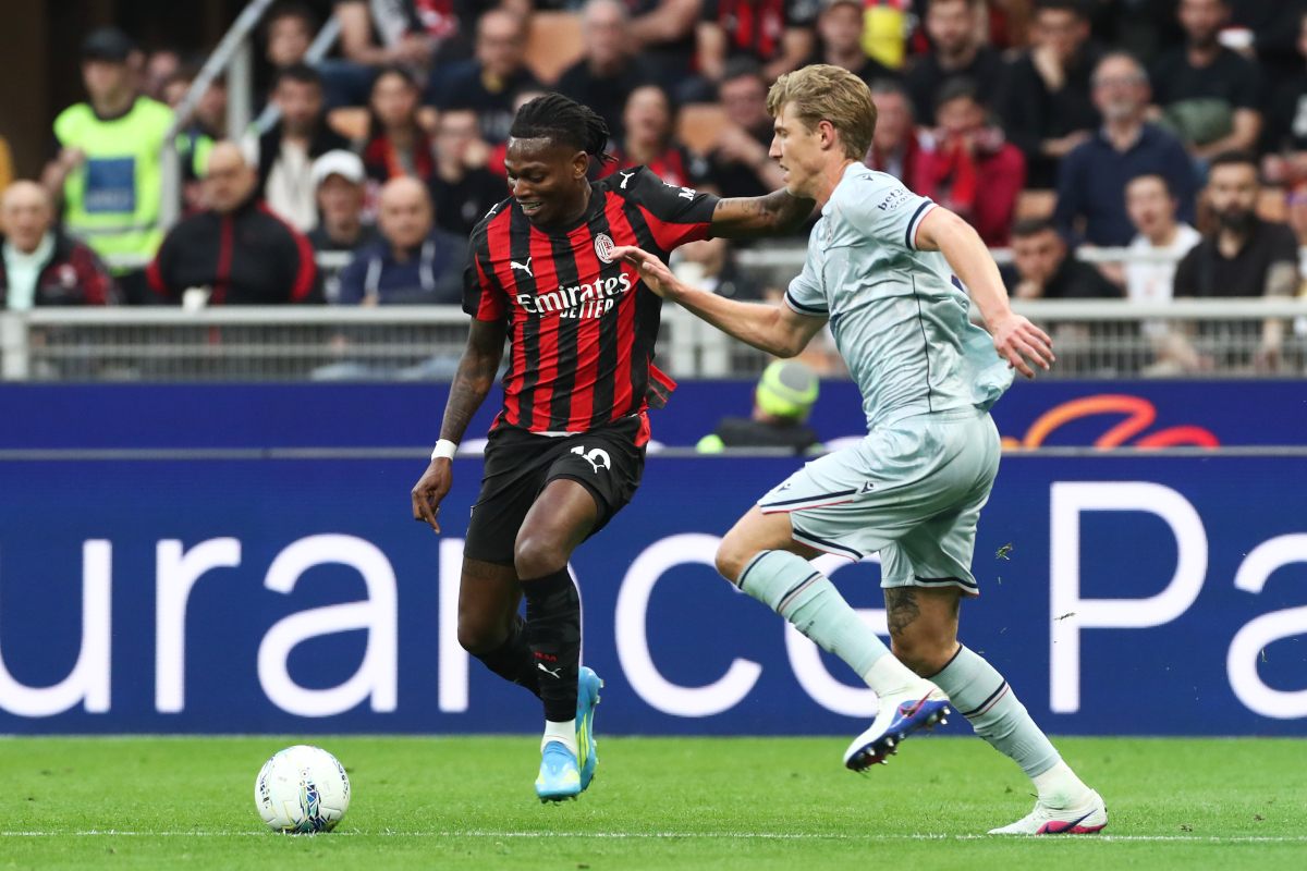 MILAN, ITALY - APRIL 11: Rafael Leao of AC Milan is put under pressure by Thomas Thiesson Kristensen of Udinese Calcio during the Serie A match between AC Milan and Udinese Calcio at Giuseppe Meazza Stadium on April 11, 2026 in Milan, Italy. (Photo by Marco Luzzani/Getty Images)