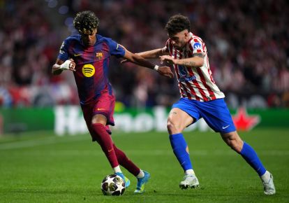 MADRID, SPAIN - APRIL 14: Lamine Yamal of FC Barcelona runs with the ball while under pressure from Matteo Ruggeri of Atletico de Madrid during the UEFA Champions League 2025/26 Quarter-Final Second Leg match between Club Atlético de Madrid and FC Barcelona at Riyadh Air Metropolitano on April 14, 2026 in Madrid, Spain. (Photo by Angel Martinez/Getty Images)