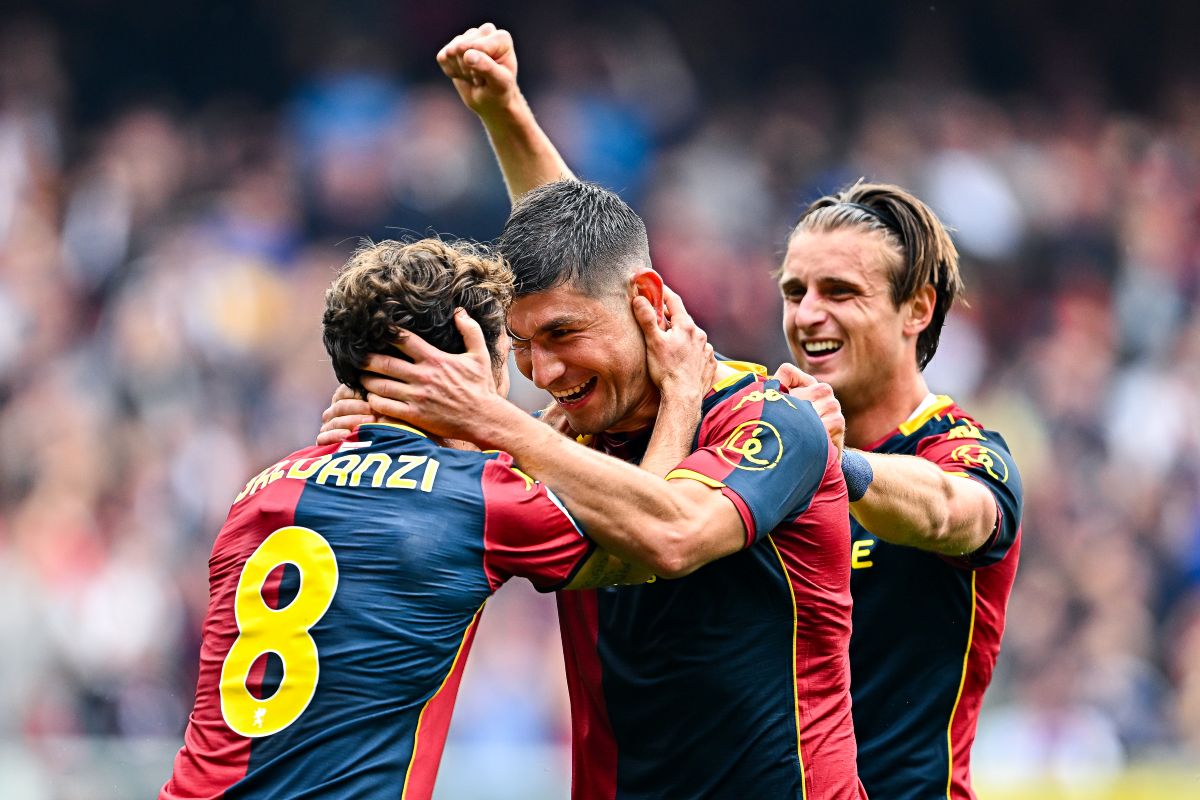 GENOA, ITALY - APRIL 12: Ruslan Malinovskyi of Genoa (center) celebrates with his team-mates Tommaso Baldanzi and Lorenzo Colombo after scoring a goal during the Serie A match between Genoa CFC and US Sassuolo Calcio at Luigi Ferraris Stadium on April 12, 2026 in Genoa, Italy. (Photo by Simone Arveda/Getty Images)