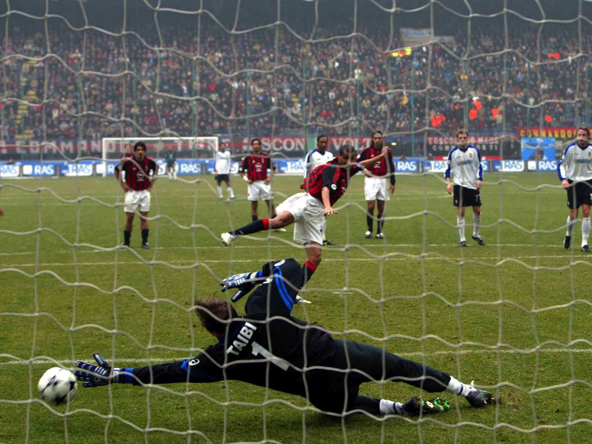 MILAN - MARCH 2: Massimo Taibi of Atalanta saves a penalty from Rivaldo of AC Milan during the Serie A match between AC Milan and Atalanta at the Giuseppe Meazza San Siro Stadium on March 2, 2003. (Photo by Grazia Neri/Getty Images)