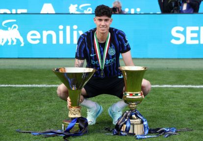 MILAN, ITALY - MAY 17: Alessandro Bastoni of FC Internazionale Milano poses for a photo with the Coppa Campioni d'Italia and Coppa Italia trophies following the Serie A match between FC Internazionale and Hellas Verona FC at Giuseppe Meazza Stadium on May 17, 2026 in Milan, Italy. (Photo by Marco Luzzani/Getty Images)