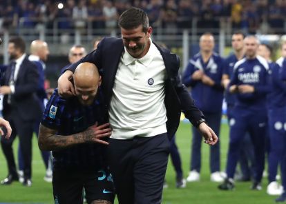 MILAN, ITALY - MAY 03: FC Internazionale coach Cristian Chivu and Federico Dimarco celebrate after being confirmed as Serie A match between FC Internazionale and Parma Calcio 1913 at Giuseppe Meazza Stadium on May 03, 2026 in Milan, Italy. (Photo by Marco Luzzani/Getty Images)