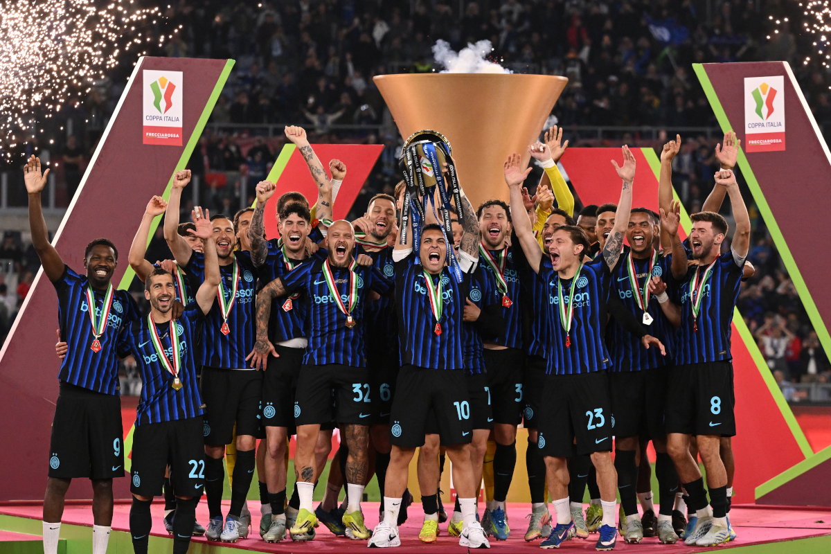 ROME, ITALY - MAY 13: Lautaro Martinez of FC Internazionale Milano lifts the Coppa Italia trophy alongside team mates after the team's victory in the Coppa Italia Final match between SS Lazio and FC Internazionale at Stadio Olimpico on May 13, 2026 in Rome, Italy. (Photo by Tullio M. Puglia/Getty Images)
