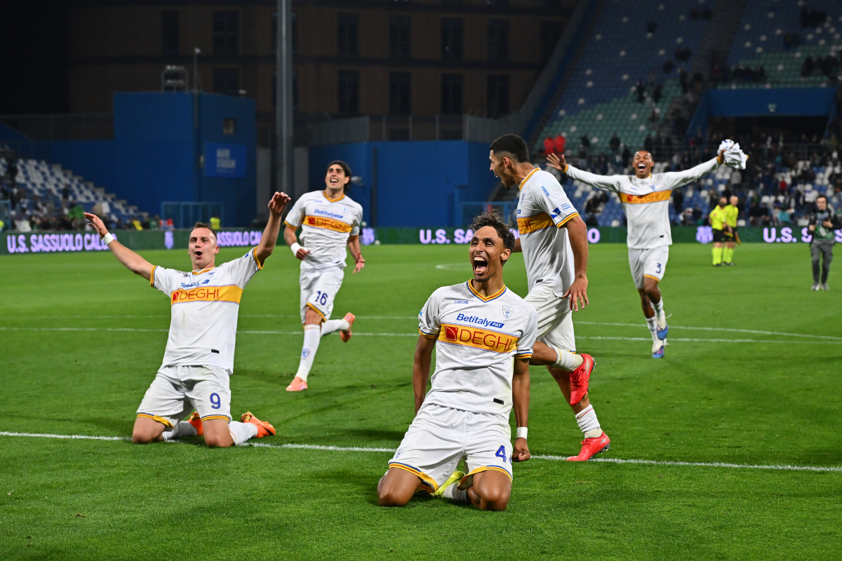 SASSUOLO, ITALY - MAY 17: Kialonda Gaspar, Nikola Stulic and Omri Gandelman of US Lecce celebrate following the team's victory in the Serie A match between US Sassuolo Calcio and US Lecce at Mapei Stadium Citta del Tricolore on May 17, 2026 in Sassuolo, Italy. (Photo by Alessandro Sabattini/Getty Images)