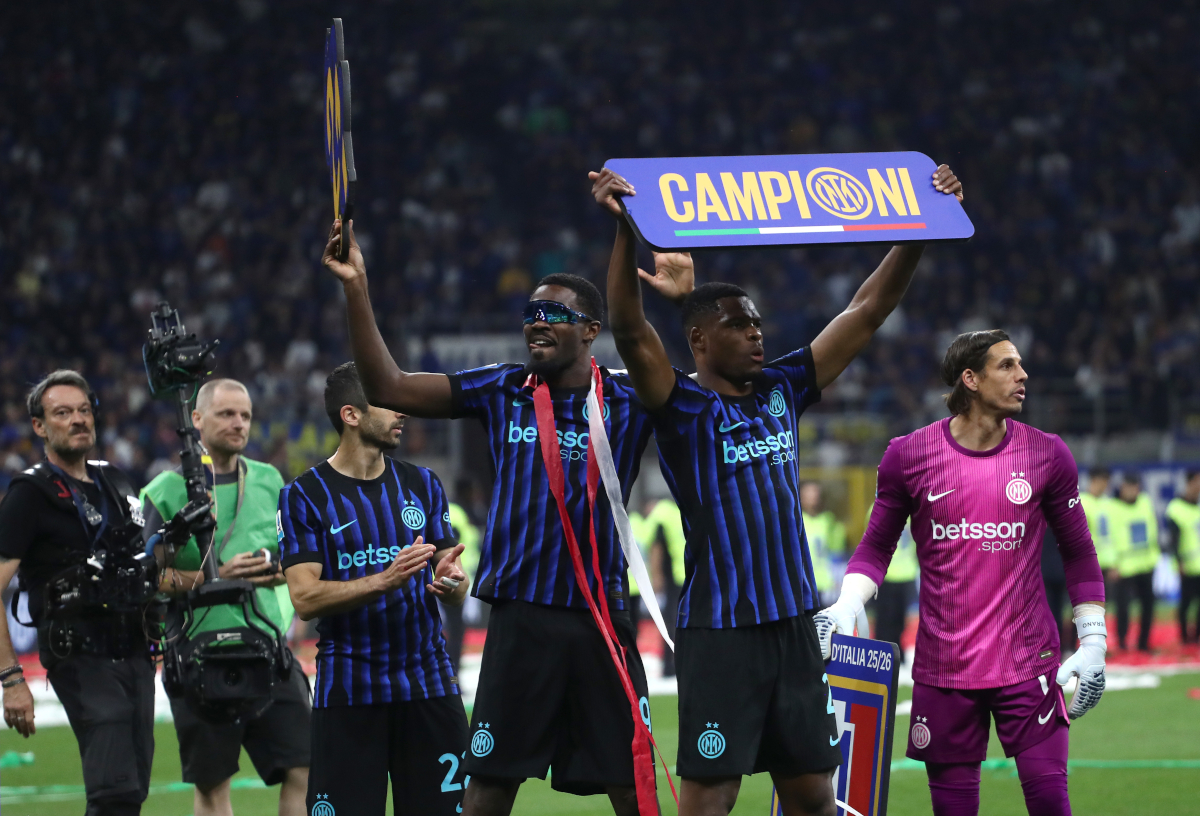 MILAN, ITALY - MAY 03: Marcus Thuram and Denzel Dumfries of FC Internazionale Milano celebrate after being confirmed as Serie A champions following victory in the Serie A match between FC Internazionale and Parma Calcio 1913 at Giuseppe Meazza Stadium on May 03, 2026 in Milan, Italy. (Photo by Marco Luzzani/Getty Images)
