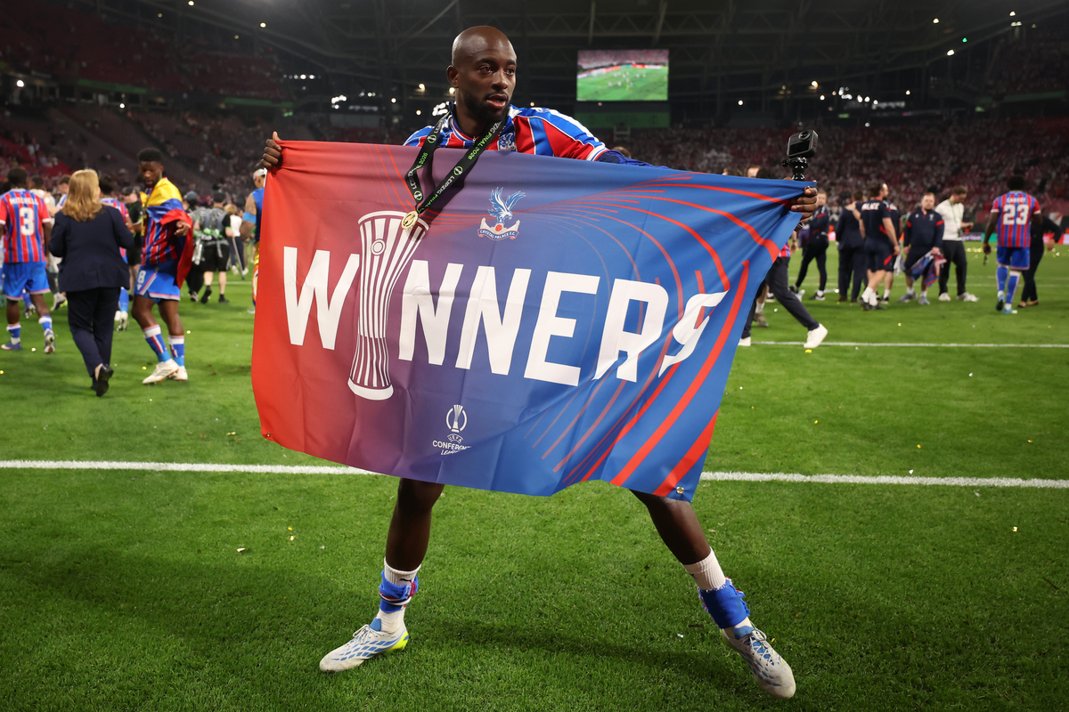 LEIPZIG, GERMANY - MAY 27: Jean-Philippe Mateta of Crystal Palace celebrates victory while holding a banner which reads