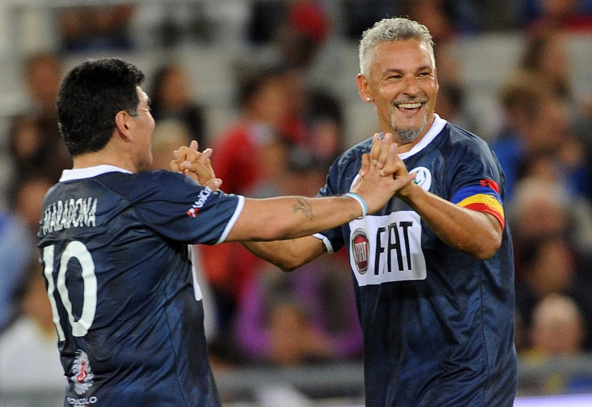 ROME, ITALY - SEPTEMBER 01:  Roberto Baggio and Diego Maradona celebrate the goal during the Interreligious Match for Peace at Olimpico Stadium on September 1, 2014 in Rome, Italy.  (Photo by Pier Marco Tacca/Getty Images)