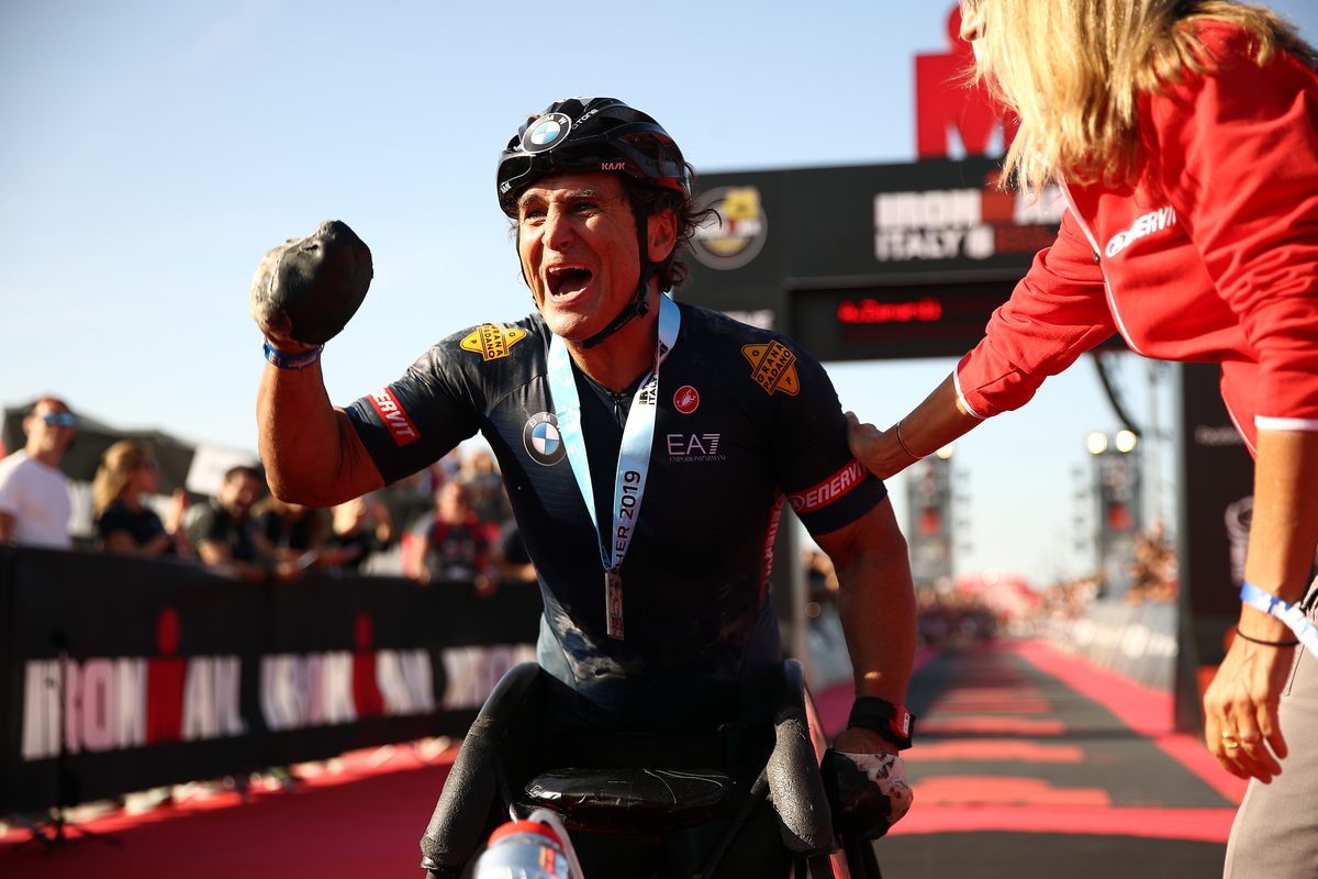 CERVIA, ITALY - SEPTEMBER 21: Alex Zanardi of Italy celebrates finishing IRONMAN Italy on September 21, 2019 in Cervia, Italy. (Photo by Bryn Lennon/Getty Images for IRONMAN)