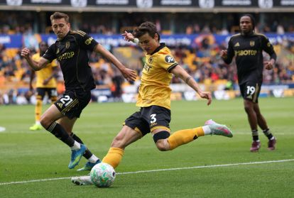 WOLVERHAMPTON, ENGLAND - MAY 17: Hugo Bueno of Wolverhampton Wanderers passes the ball under pressure from Timothy Castagne of Fulham during the Premier League match between Wolverhampton Wanderers and Fulham at Molineux on May 17, 2026 in Wolverhampton, England. (Photo by Alex Pantling/Getty Images)