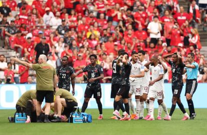 VANCOUVER, BRITISH COLUMBIA - JUNE 18: Players of Canada react as Ismael Kone #8 of Canada receives medical attention during the FIFA World Cup 2026 Group B match between Canada and Qatar at BC Place Vancouver on June 18, 2026 in Vancouver, British Columbia. (Photo by Fran Santiago/Getty Images)