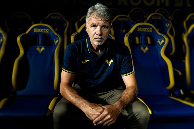 Marco Baroni poses in the dugout after being confirmed as the new head coach of Hellas Verona for the 2026-27 season. (via www.hellasverona.it)