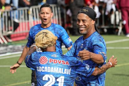 CARACAS, VENEZUELA - JUNE 6: Former Brazilian football star Ronaldinho takes part in an exhibition match as part of the Liga Monumental tournament on June 6, 2026 in Caracas, Venezuela. Hundreds of children and teenagers attended the event in the Mesuca sector of Petare, one of Venezuela's largest informal settlements. (Photo by Jesus Vargas/Getty Images)