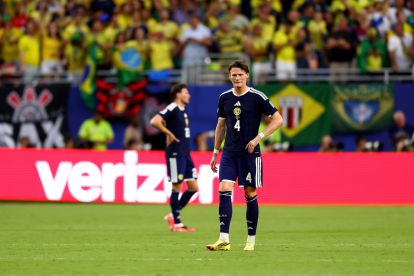 MIAMI GARDENS, FLORIDA - JUNE 24: Scott McTominay #4 of Scotland reacts after conceding a third Brazil goal to Matheus Cunha #9 of Brazil during the FIFA World Cup 2026 Group C match between Scotland and Brazil at Miami Stadium on June 24, 2026 in Miami Gardens, Florida. (Photo by Megan Briggs/Getty Images)