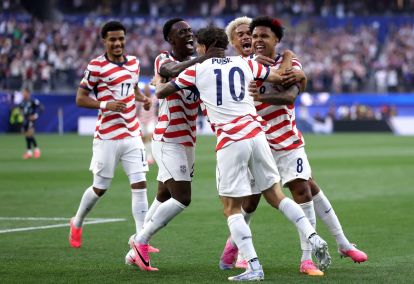 LOS ANGELES, CALIFORNIA - JUNE 12: Christian Pulisic #10 and Weston McKennie #8 of the United States celebrate their side's first goal, an own goal by Damian Bobadilla #16 of Paraguay (not pictured), during the FIFA World Cup 2026 Group D match between USA and Paraguay at Los Angeles Stadium on June 12, 2026 in Los Angeles, California. (Photo by Dean Mouhtaropoulos/Getty Images)