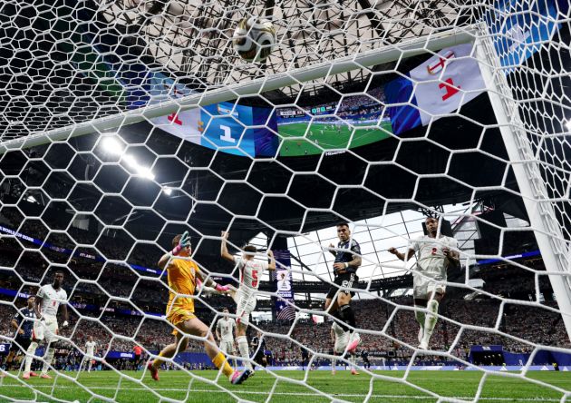 ATLANTA, GEORGIA - JULY 15: (EDITOR'S NOTE: Image was captured using a remote camera from behind the goal.) Lautaro Martinez #22 of Argentina scores his team's second goal past Jordan Pickford #1 of England during the FIFA World Cup 2026 Semi Final match between England and Argentina at Atlanta Stadium on July 15, 2026 in Atlanta, Georgia. (Photo by Buda Mendes/Getty Images)