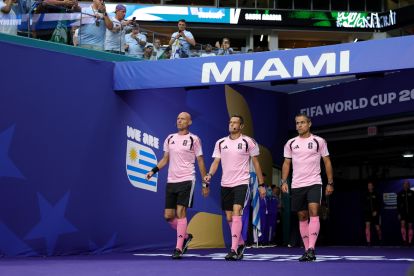 MIAMI GARDENS, FLORIDA - JUNE 15: Referee Maurizio Mariani (C) walks out of the tunnel with match officials for warm ups before the FIFA World Cup 2026 Group H match between Saudi Arabia and Uruguay at Miami Stadium on June 15, 2026 in Miami Gardens, Florida. (Photo by Alex Slitz/Getty Images)