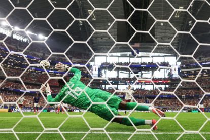 ARLINGTON, TEXAS - JULY 14: (EDITOR'S NOTE: Image was captured using a remote camera from behind the goal.) Mikel Oyarzabal #21 of Spain converts a penalty to score his team's first goal past Mike Maignan #16 of France during the FIFA World Cup 2026 Semi Final match between France and Spain at Dallas Stadium on July 14, 2026 in Arlington, Texas. (Photo by Lars Baron/Getty Images)