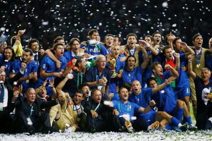 BERLIN - JULY 09: The Italian players and coaching staff celebrate following their victory in a penalty shootout at the end of the FIFA World Cup Germany 2006 Final match between Italy and France at the Olympic Stadium on July 9, 2006 in Berlin, Germany. (Photo by Lars Baron/Bongarts/Getty Images)