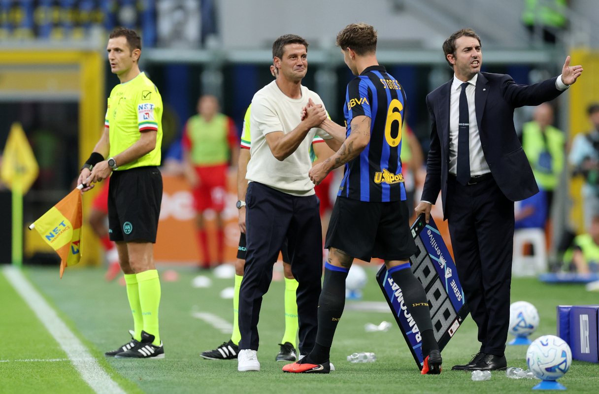MILAN, ITALY - AUGUST 22: John Stones of Internazionale shakes hands with Cristian Chivu, Head Coach of Internazionale before coming on as a substitute during the Serie A match between FC Internazionale and AC Monza at Stadio Giuseppe Meazza on August 22, 2026 in Milan, Italy. (Photo by Claudio Villa/Getty Images)
