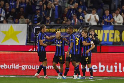 PERTH, AUSTRALIA - AUGUST 05: Federico Dimarco of FC Internazionale hugs his team mates after his goal during the pre-season match between AC Milan and FC Internazionale at Optus Stadium on August 05, 2026 in Perth, Australia. (Photo by James Worsfold/Getty Images)