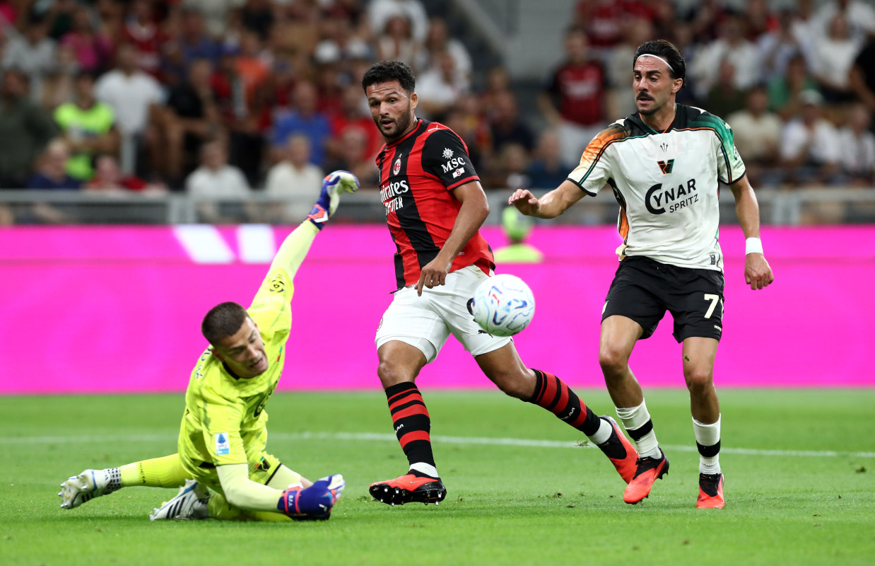 MILAN, ITALY - AUGUST 28: Goncalo Ramos of Milan shoots past Filip Stankovic of Venezia under pressure from Kike Perez of Venezia during the Serie A match between AC Milan and Venezia FC at Stadio Giuseppe Meazza on August 28, 2026 in Milan, Italy. (Photo by Marco Luzzani/Getty Images)