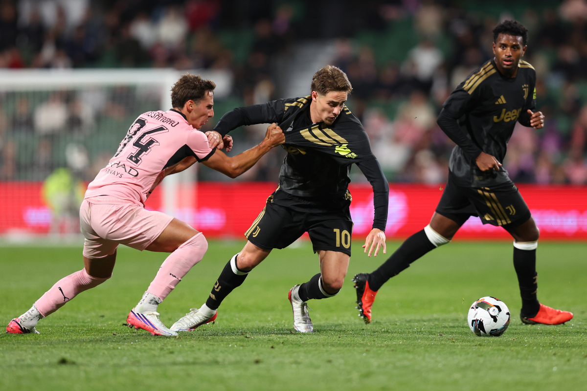 PERTH, AUSTRALIA - AUGUST 11: Kenan Yildiz of Juventus controls the ball against Tommaso Cassandro of Palermo FC during the match between Juventus and Palermo at HBF Park on August 11, 2026 in Perth, Australia. (Photo by Paul Kane/Getty Images)