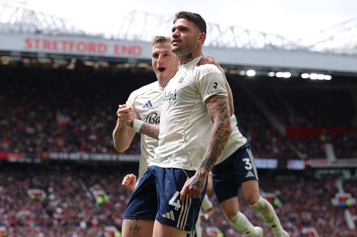 MANCHESTER, ENGLAND - MAY 17: Morato of Nottingham Forest celebrates scoring his team's first goal with teammate Chris Wood during the Premier League match between Manchester United and Nottingham Forest at Old Trafford on May 17, 2026 in Manchester, England. (Photo by Alex Livesey/Getty Images)