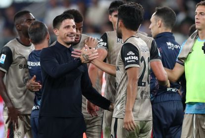 BERGAMO, ITALY - SEPTEMBER 12: Cagliari Calcio head coach Fabio Pisacane and Yukinari Sugawara of Cagliari Calcio celebrate the victory at the end of the Serie A match between Atalanta BC and Parma Calcio at Stadio Atleti Azzurri d'Italia on September 12, 2026 in Bergamo, Italy. (Photo by Marco Luzzani/Getty Images)