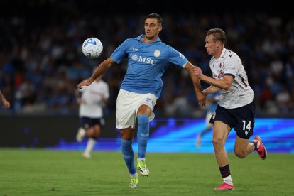 NAPLES, ITALY - SEPTEMBER 13: Lorenzo Lucca of SSC Napoli battles for possession with Torbjorn Heggem of Bologna FC during the Serie A match between SSC Napoli and Bologna FC at Stadio Diego Armando Maradona on September 13, 2026 in Naples, Italy. (Photo by Francesco Pecoraro/Getty Images)