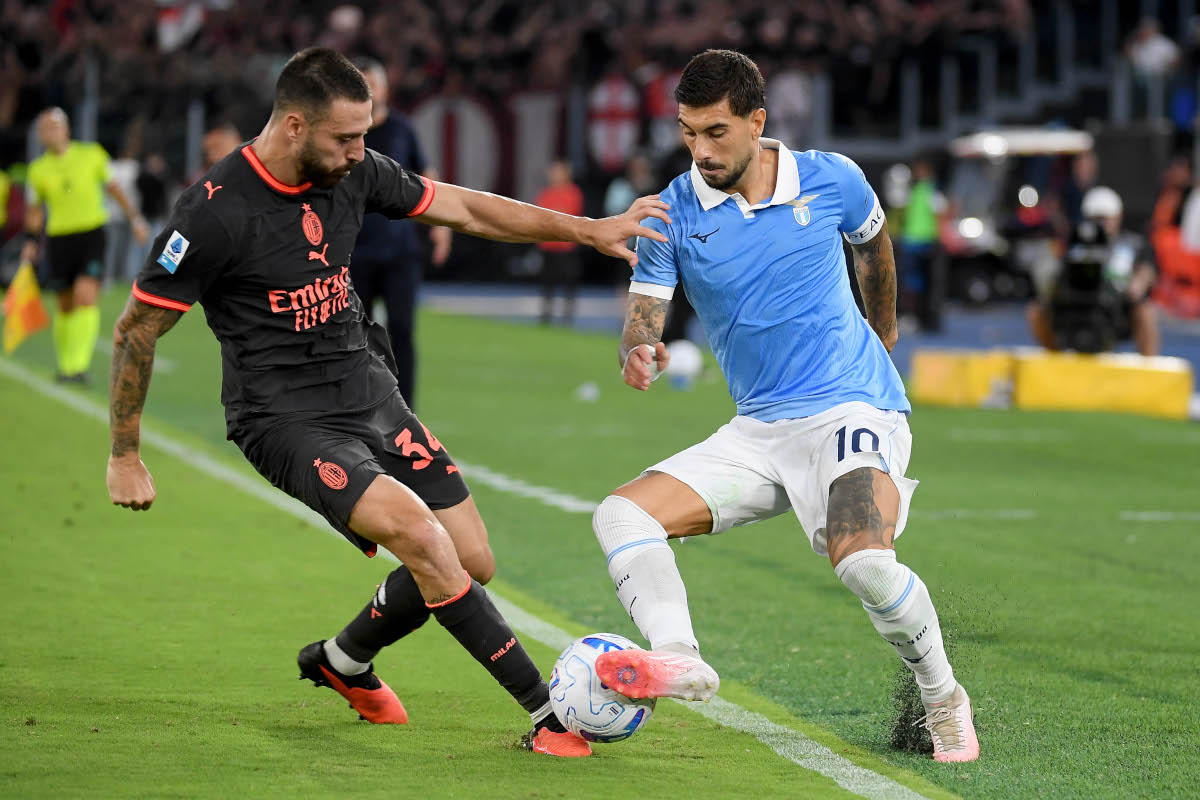 ROME, ITALY - SEPTEMBER 12: Mattia Zaccagni of SS Lazio competes for the ball with Mario Gila of AC Milan during the Serie A match between SS Lazio and AC Milan at Stadio Olimpico on September 12, 2026 in Rome, Italy. (Photo by Marco Rosi - SS Lazio/Getty Images)