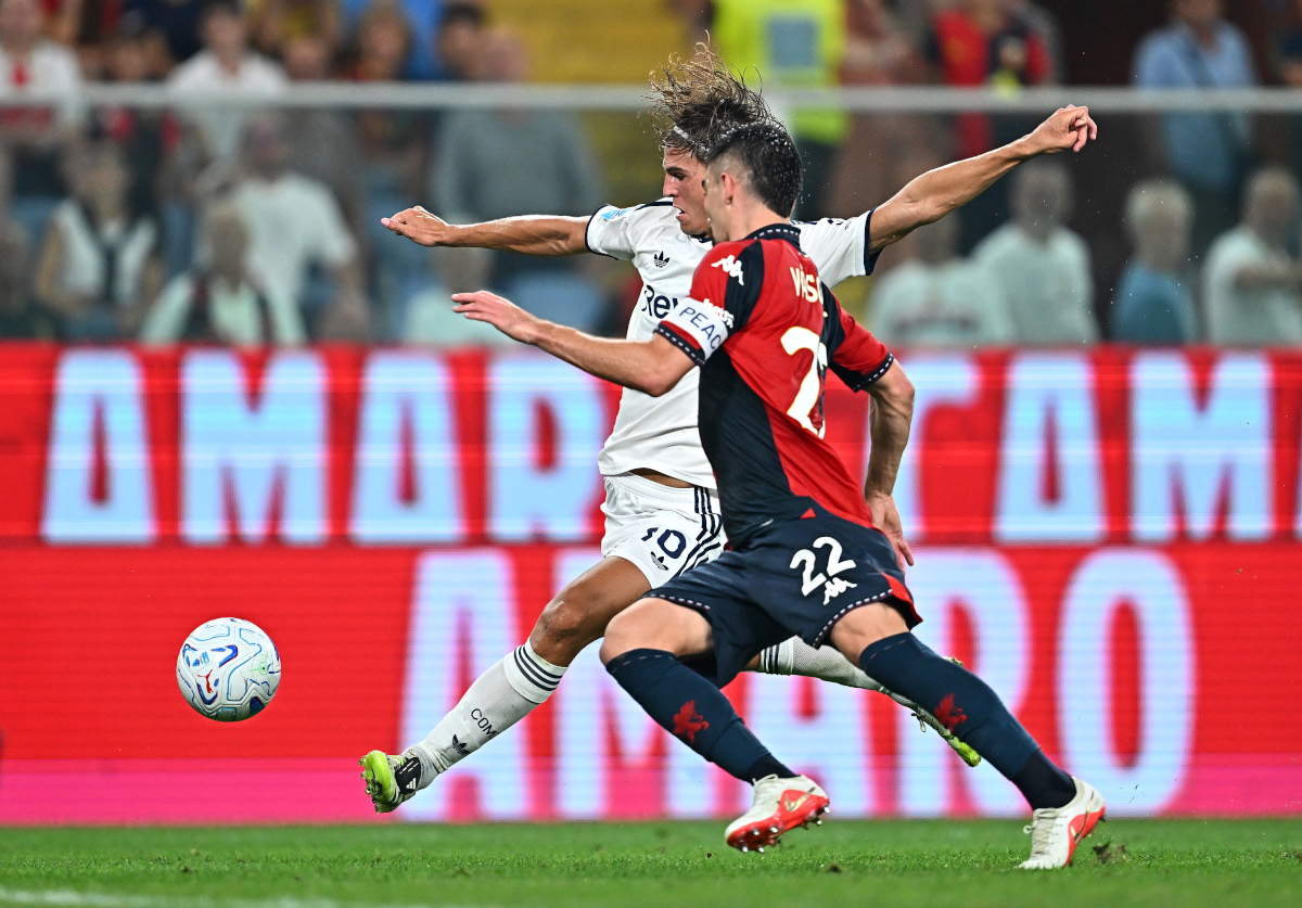 GENOA, ITALY - SEPTEMBER 04: Nico Paz of Como scores his team’s third goal under pressure from Johan Vasquez of Genoa during the Serie A match between Genoa CFC and Como 1907 at Stadio Luigi Ferraris on September 04, 2026 in Genoa, Italy. (Photo by Simone Arveda/Getty Images)