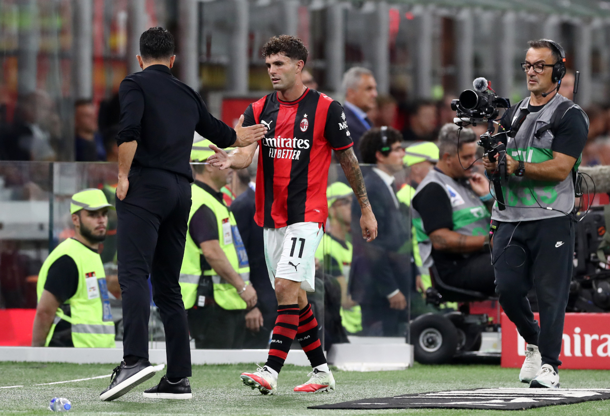 ITALY - SEPTEMBER 20: Ruben Amorim, Manager of AC Milan, interacts with Christian Pulisic of AC Milan as he is substituted off during the Serie A match between AC Milan and US Lecce at Stadio Giuseppe Meazza on September 20, 2026 in Italy. (Photo by Marco Luzzani/Getty Images)