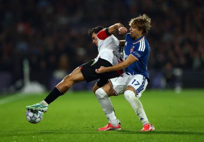 ROTTERDAM, NETHERLANDS - OCTOBER 14: Javi Lopez of Feyenoord is challenged by Jesus Rodriguez of Como 1907 during the UEFA Champions League 2026/27 League Phase MD2 match between Feyenoord and Como 1907 at De Kuip on October 14, 2026 in Rotterdam, Netherlands. (Photo by Dean Mouhtaropoulos/Getty Images)