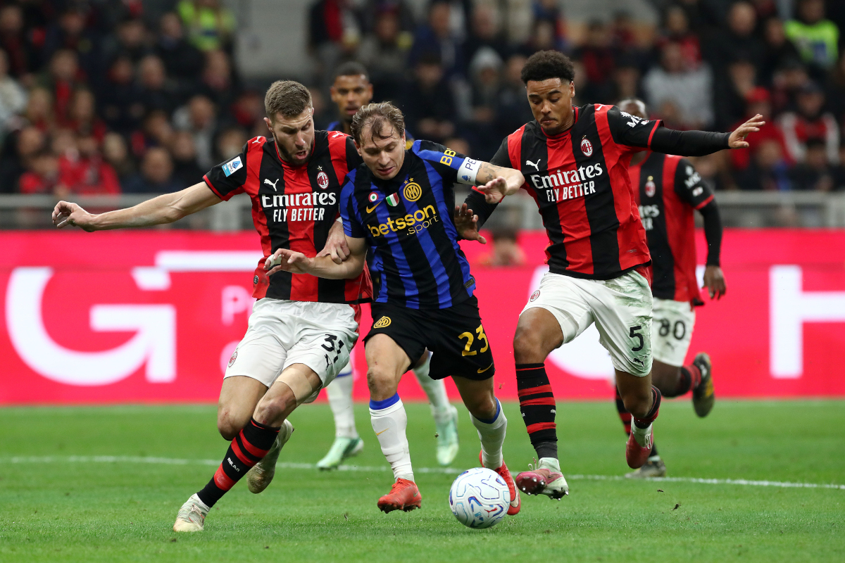 ITALY - OCTOBER 31: Nicolo Barella of FC Internazionale is challenged by Strahinja Pavlovic and Koni De Winter of AC Milan during the Serie A match between AC Milan and FC Internazionale at Stadio Giuseppe Meazza on October 31, 2026 in Italy. (Photo by Marco Luzzani/Getty Images)