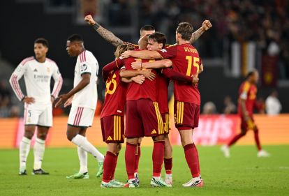 ROME, ITALY - OCTOBER 14: Donyell Malen of AS Roma celebrates scoring his team’s third goal with teammates during the UEFA Champions League 2026/27 League Phase MD2 match between AS Roma and Real Madrid C.F. at Stadio Olimpico on October 14, 2026 in Rome, Italy. (Photo by Tullio M. Puglia/Getty Images)
